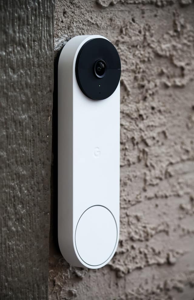 Smart Door Bell / Camera hanging on the side of a wall